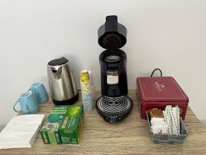 a coffee maker sitting on top of a table at Affitto nel cuore del Salento in Poggiardo