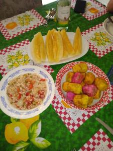 two plates of food on a table with plates of food at Affitto nel cuore del Salento in Poggiardo