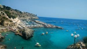 a group of people in the water at a beach at Affitto nel cuore del Salento in Poggiardo +38 photos