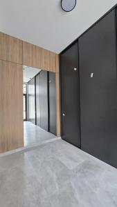 a row of glass doors in a building at Apartman Lady A2 Istočno Sarajevo in Vranješ