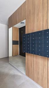 a room with blue lockers and a door at Apartman Lady A2 Istočno Sarajevo in Vranješ