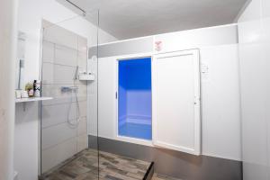 a bathroom with a shower with a glass door at Casa Toma in Sovata +34 photos