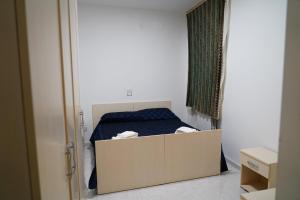 a bedroom with a bed and a cabinet in it at B e B LEMI in Ponte +12 photos