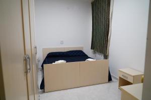a bedroom with a bed with a box in it at B e B LEMI in Ponte