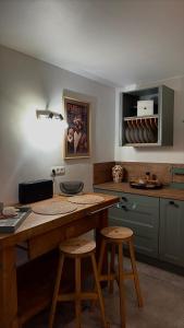a kitchen with a counter and stools in a room at Chez Firmin in Manhay +50 photos