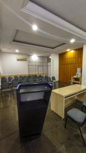a conference room with a table and chairs in it at Foz Presidente Comfort Hotel in Foz do Iguaçu +175 photos