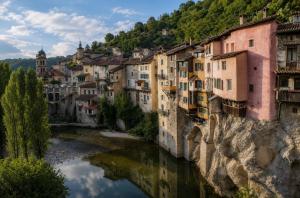 a group of buildings on the side of a river at Les Chalets Horizon in Saint-Just-de-Claix
