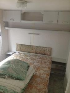 a bedroom with a bed in a room at Camping les sumacs in Combles