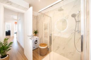 a bathroom with a shower and a washing machine at You and the Sea in Savona +21 photos