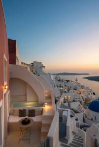 a view of the city from the rooftop of a building at Armenaki in Oia