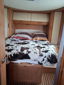 a bed in the middle of a room at Chambre in Saint-Georges-du-Bois