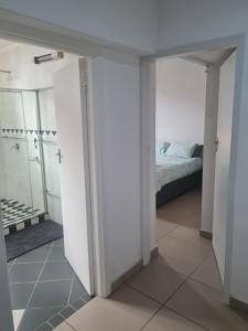 a room with a bedroom and a bed at Comfortable Secure Business Stay in Johannesburg