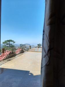 a view of a tennis court from a window at Hotel Lords Regency - Connected to the Mall Road in Shimla