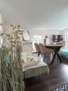 a living room with a table and chairs and a dining room at House Susanne in Cologne