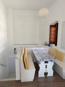 a kitchen with a table and some boxes at Villa Marco Polo in Agia Marina