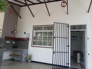 an open door of a house with a fireplace at The Sun Horse Villa in Unawatuna