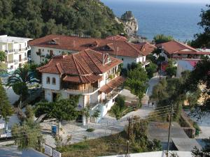 an aerial view of a resort with the ocean at Oasis in Parga
