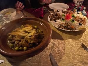 a table with two bowls of food on it at Grand Dunes Luxury Camp in Merzouga
