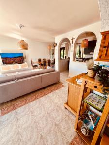 a living room with a couch and a table at Casa Milano Krk in Njivice