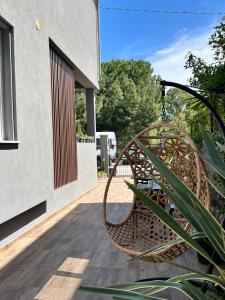 a rattan chair sitting on a patio at Umi B&B in Giulianova
