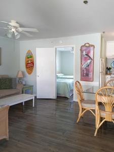 a living room with a bed and a couch at Carolina Blue in North Myrtle Beach