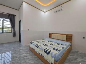 a bedroom with a bed in a room at MAY homestay in Phú Khương
