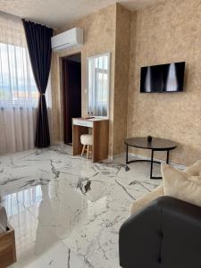 a living room with a marble floor at Стаи за гости- Maria Elegance in Pavel Banya +63 photos