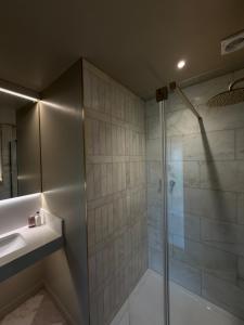 a bathroom with a shower and a sink at Riverside Stay in Morpeth +23 photos