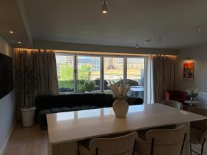 a living room with a table and a couch at Riverside Stay in Morpeth