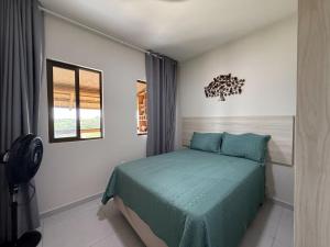a bedroom with a bed and a window at dreams of the mountains in Bananeiras +68 photos