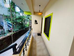 a hallway of a house with a bench and a window at Seven Summers - Mandrem in Mandrem