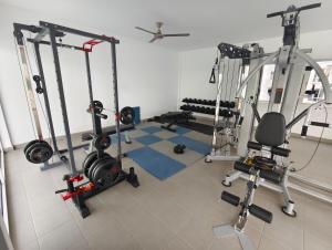 a room with a gym with several tread machines at RAF Homestay Seri Serindit in Malacca
