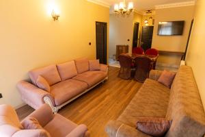a living room with a couch and tables and chairs at The Old Ottoman Castle in Istanbul