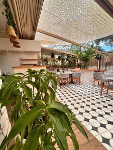 a restaurant with a patio with tables and chairs at Casa Fiore in Seferihisar