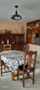a kitchen with a table and a dining room at La crapaudiere in Charrin