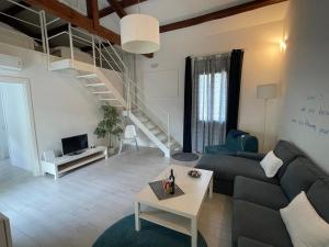 a living room with a couch and a table at Appartamento Al Bianco Convento in Venice-Lido
