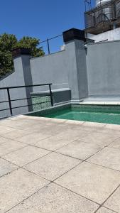 a house with a swimming pool on top of it at Ballester apart piscina in Villa Ballester