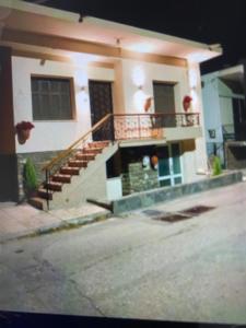 a house with a staircase in front of it at VILLA MAKRI 2 in Makri