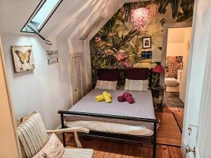 a room with a bed with two stuffed animals on it at alojamento maritimo II in Espinho +141 photos