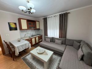 a living room with a couch and a table at GRANDPA's HOME in Pusteci