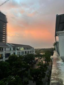 a view from the balcony of a building at sunset at Rémi Homestay in Thôn Văn Dương