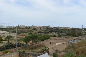 a view of a city from the top of a hill at KY Orange Grove in Kerċem