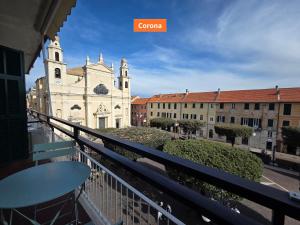 a view of a church from a balcony at Principe - By Turent in Pietra Ligure