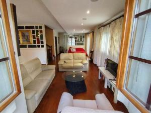a living room with a couch and a table at Balentzenea Rural House in Lesaka