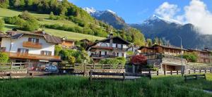 a group of houses in a village in the mountains at B&B Hannelore in Vilminore