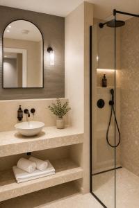 a bathroom with a sink and a shower at HeyMi Apartments Brick Lane Vienna in Vienna