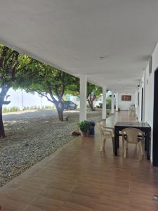 a dining room with a table and chairs under a tent at caribepremiumvalledupar in Valledupar
