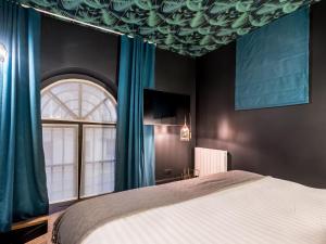 Un pat sau paturi într-o cameră la 1er Etage SoPi-Montmartre