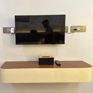 a flat screen tv hanging on a wall at Hotel silver star in Kishanganj Bazar