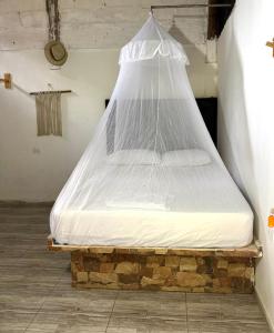 a mattress wrapped in plastic sitting on top of a brick at Quinto Hotel in Palomino